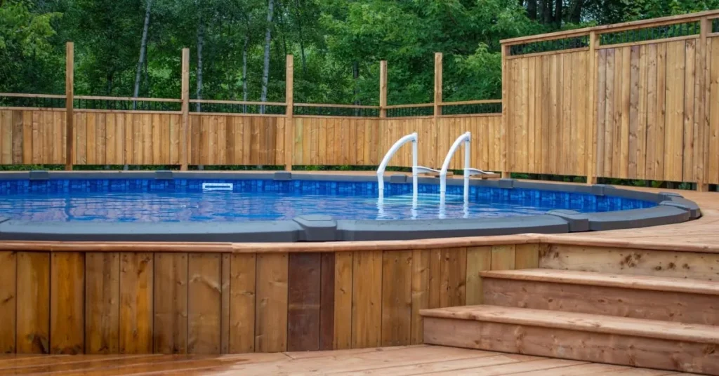 Elevated above-ground pool deck surrounded by wooden fencing, demonstrating the structural support offered by screw piles.